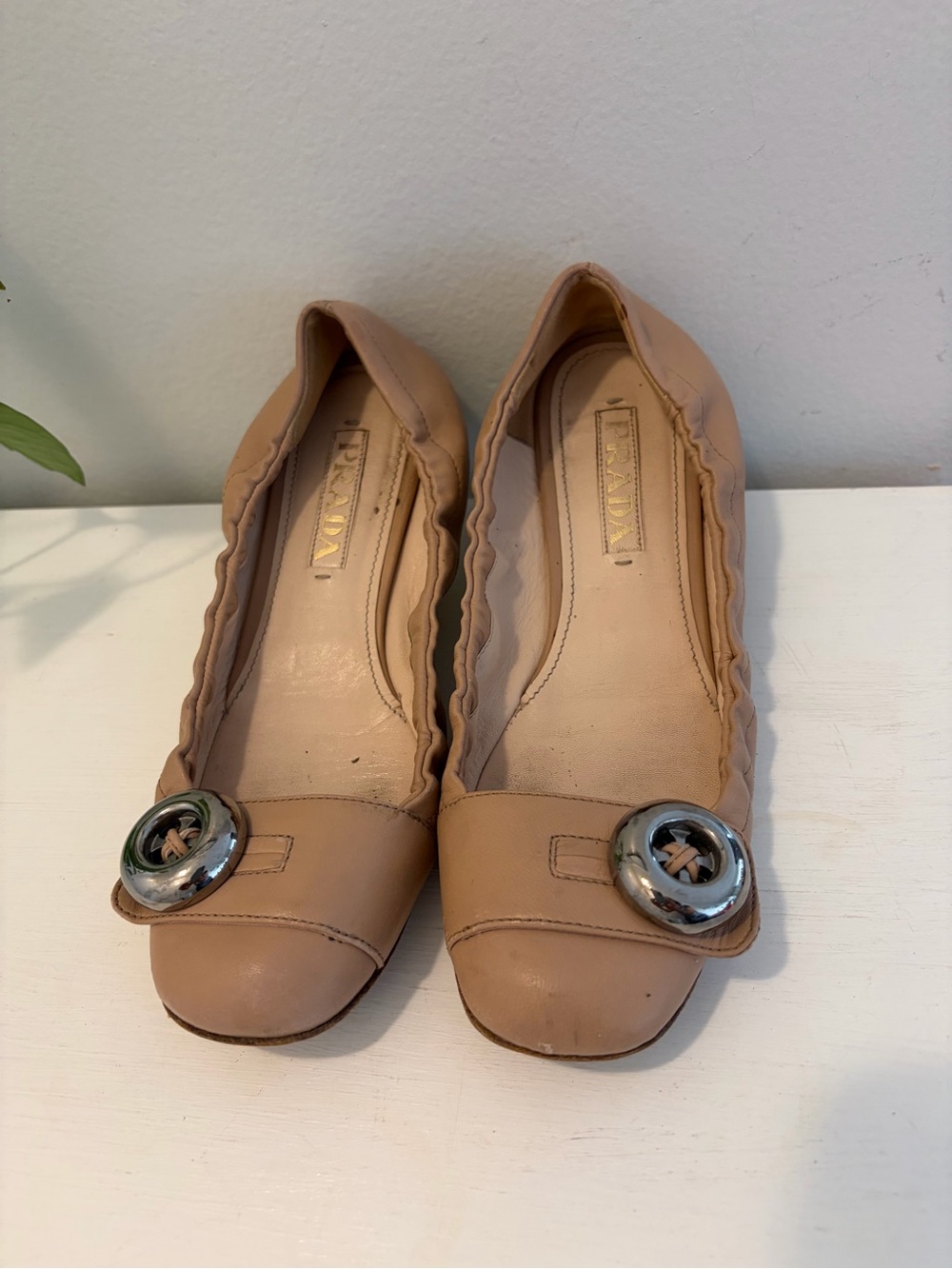 PRADA 
Nude Leather Ballet Flats with Silver Accent